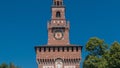 Tower with clock of the Sforza Castle - Castello Sforzesco timelapse, Milan, Italy Royalty Free Stock Photo