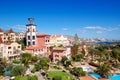 Tower with clock and swimming pool at the luxury hotel Royalty Free Stock Photo