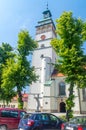 Tower of Co-Cathedral of the Nativity of the Blessed Virgin Mary. View on Tower between trees. Royalty Free Stock Photo