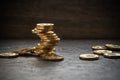 Tower of coins, metal money stacked on the table on a dark background, financial and banking concept, savings, deposit insurance, Royalty Free Stock Photo