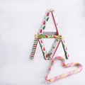 Tower of colorful chocolates and candy canes drawing a heart shape