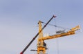 Tower crane assembly. Installation of a construction crane before starting construction. Construction crane assembly stage