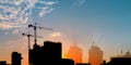 about the tower crane at the building construction in the city when the silhouette Royalty Free Stock Photo