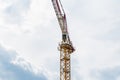 Tower crane and building construction site silhouette at cloudy blue and white sky Royalty Free Stock Photo