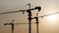 Tower crane at building construction site silhouette Royalty Free Stock Photo