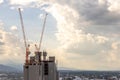 Tower crane and building construction site, Workers are working on construction sites and cranes are working in the industry new Royalty Free Stock Photo