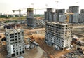 Tower crane on building construction, top view. Builder on formworks