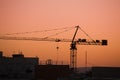 Tower crane on a construction site at sunrise Royalty Free Stock Photo