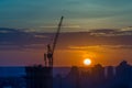 Tower crane on a construction site at sunrise Royalty Free Stock Photo