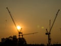 Tower crane on a construction site at sunrise Royalty Free Stock Photo