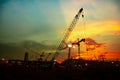 about the tower crane at a construction site when sunset and colour full Royalty Free Stock Photo