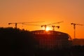 Tower crane on a construction site at sunset Royalty Free Stock Photo