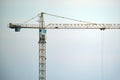 Tower crane at high residential apartment buildings construction site. Real estate development Royalty Free Stock Photo