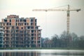 Tower crane at high residential apartment buildings construction site. Real estate development Royalty Free Stock Photo