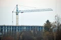 Tower crane at high residential apartment buildings construction site. Real estate development Royalty Free Stock Photo