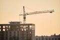 Tower crane at high residential apartment buildings construction site. Real estate development Royalty Free Stock Photo