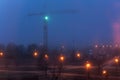 Tower crane and illumination at night, construction site