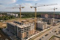 Tower crane on multi-storey housing construction site Royalty Free Stock Photo