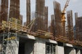 Tower crane near building under construction on sunny day Royalty Free Stock Photo