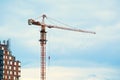 Tower crane next to unfinished building