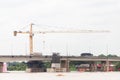 tower crane over river bridge under construction Royalty Free Stock Photo