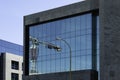 Tower crane reflected in the front of an office building Royalty Free Stock Photo