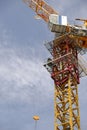 Tower crane soars into blue sky Royalty Free Stock Photo
