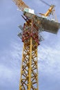 Tower crane soars into blue sky Royalty Free Stock Photo