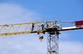 Tower Crane and Workers Against Blue Sky