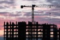 Tower crane, workers work at construction site. Process of building new houses Royalty Free Stock Photo