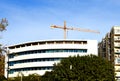 Tower cranes in action a building construction. Construction residential buildings Royalty Free Stock Photo