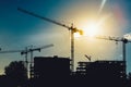 Tower cranes on industrial construction site. New district development and skyscraper building Royalty Free Stock Photo