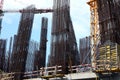 Tower cranes near building under construction against blue sky Royalty Free Stock Photo