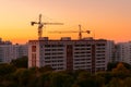 Tower cranes on rooftops