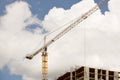 Tower cranes work during the construction of a multi-story building. New apartments for residents and premises for offices. Risky Royalty Free Stock Photo