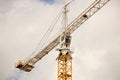 Tower cranes work during the construction of a multi-story building. New apartments for residents and premises for offices. Risky