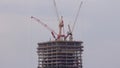 Tower cranes working on the construction site of new skyscraper high-rise building aerial timelapse. Dubai Royalty Free Stock Photo