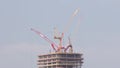 Tower cranes working on the construction site of new skyscraper high-rise building aerial timelapse. Dubai Royalty Free Stock Photo