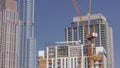 Tower cranes working on the construction site of new skyscraper high-rise building aerial timelapse. Dubai Royalty Free Stock Photo