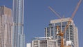 Tower cranes working on the construction site of new skyscraper high-rise building aerial timelapse. Dubai Royalty Free Stock Photo