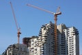 Tower Cranes Working on a High Rise Building under Construction