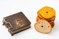 Tower of crispy toasted toast and antique paper notebook