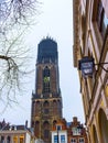 The tower of the Dom cathedral above a row of historical houses of Utrecht, Holland Royalty Free Stock Photo