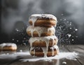 A tower of donuts, glazed and sprinkled with powdered sugar. Wooden table, dark gray background. Sweet dessert