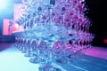 A tower of empty martini glasses with a cherry is on the table. Party at the Club Phaselis Rose Hotel in Kemer, Turkey, a festive