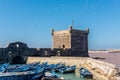 The tower of Essaouira with blue boats