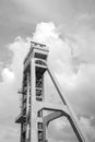 The tower of the former mine shaft against the blue sky. Currently an observation tower. A monument of technology. Black and white Royalty Free Stock Photo
