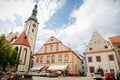 Tower of the gothic Church of the Transfiguration on Mount and Brewing Museum on main Square of Jan Zizka, cityscape of medieval