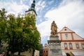 Tower of the gothic Church of Transfiguration on Mount and Statue of Jan Zizka of Trocnov on main square, cityscape of medieval