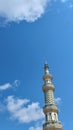 tower of the grand mosque and beautiful sky at cilacap, central java, indonesia